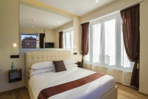 Postel nebo postele na pokoji v ubytování Aiello Rooms - San Babila