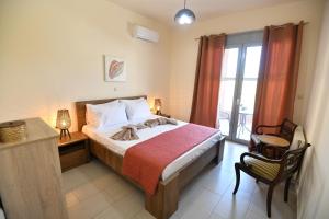 Posteľ alebo postele v izbe v ubytovaní Dionysus seaside villa