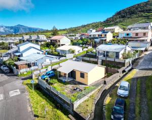 an aerial view of a small town with houses at Villa la fournaise in Le Tampon