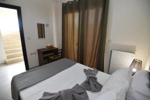 Posteľ alebo postele v izbe v ubytovaní Dionysus seaside villa