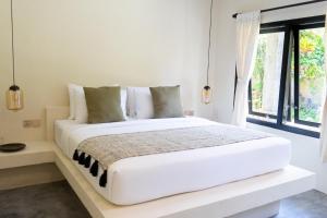 Voodi või voodid majutusasutuse Savanna Ubud toas