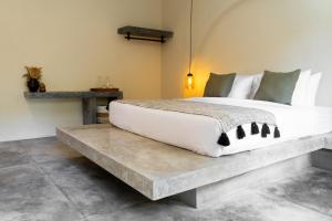 Voodi või voodid majutusasutuse Savanna Ubud toas