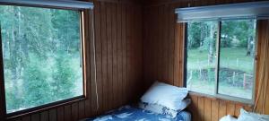 Postel nebo postele na pokoji v ubytování HOSTAL CARHUELLO