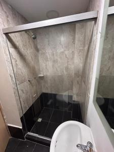 a bathroom with a shower with a toilet and a sink at Habitación Principal Con Baño Privado in Sabaneta