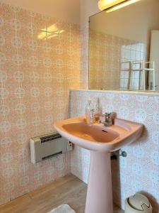 a bathroom with a sink and a mirror at French Riviera apartment with swimming pool and free parking near Monaco in Roquebrune-Cap-Martin