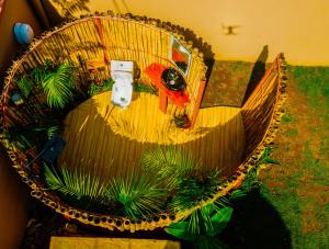 an overhead view of a basket with plants in it at Safi House in Boma la Ngombe