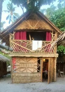 a house that is made out of wood at Bice Camp Darocotan in El Nido