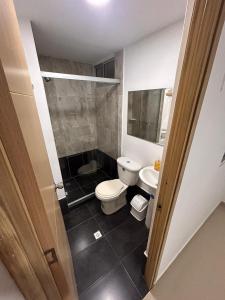 a small bathroom with a toilet and a sink at Habitacion Con Balcon Privado in Sabaneta