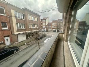 a view from a window of a street with buildings at Appartement rénové in Brussels