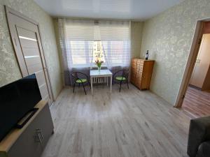TV a/nebo společenská místnost v ubytování Narva City Hall Apartment
