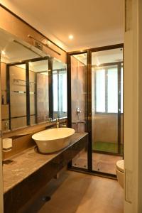 a bathroom with a large sink and a shower at SHREE VILLA in Jaipur