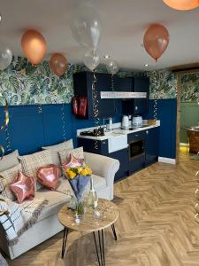 a living room with a couch and a table at The Rhossili bay secret in Swansea