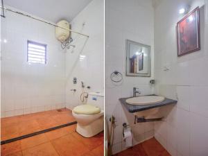 a white bathroom with a toilet and a sink at Hilltop 3BHK Villa With Private Pool Near Candolim in Candolim