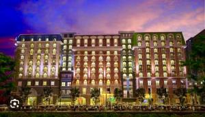 a large building with lights in front of it at 1 Bedroom Condo unit across Iloilo Convention Center in Iloilo City
