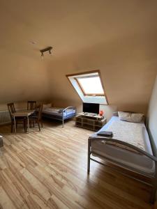 a bedroom with a bed and a skylight at Penthouse - 4-Zimmer und Terrasse in Karlsbad