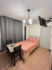 Llit o llits en una habitació de Condominio Confort