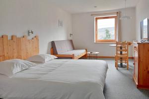 Postel nebo postele na pokoji v ubytování Gîte Les 4 Saisons