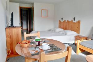Postel nebo postele na pokoji v ubytování Gîte Les 4 Saisons