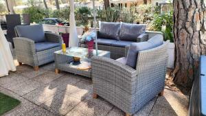 a group of chairs and a table on a patio at Village l oasis in Puget-sur-Argens +4 photos