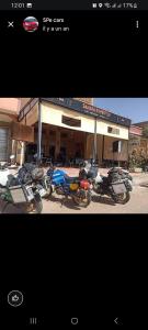 a group of motorcycles parked in front of a store at SAHARA EXPERTISE in Tagounite