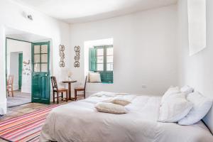 Postel nebo postele na pokoji v ubytování Fundo Chincheros Lodge