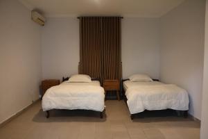 Ένα ή περισσότερα κρεβάτια σε δωμάτιο στο Mesari Cottage Guest House