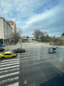 a group of cars driving down a city street at Apartament Central Tulcea in Tulcea