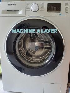 a washing machine with the words machine aayer on it at Studio dans belle maison ancienne et jardin fermé in LʼÉtoile