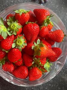 a bowl of strawberries sitting on a table at Bru Na Pairc B&B in Bantry