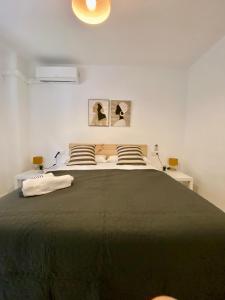 a bedroom with a large bed with two pillows at Apartamento nuevo en centro 19743 in Córdoba
