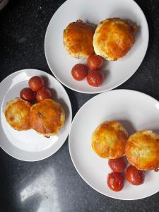 three plates with donuts and grapes on a table at Bru Na Pairc B&B in Bantry