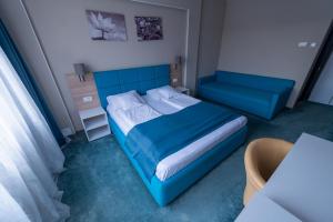 Postel nebo postele na pokoji v ubytování Complex Turistic Monaco
