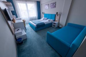 Postel nebo postele na pokoji v ubytování Complex Turistic Monaco