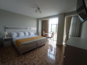 Postel nebo postele na pokoji v ubytování Mercé Hotel