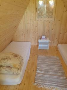 Postel nebo postele na pokoji v ubytování GLAMPING HOUSE ˇVITAˇ