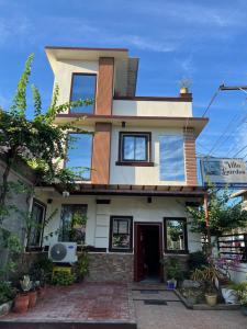 a house with a lot of windows at Villa Lourdes in Alaminos