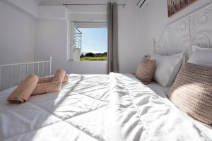 Postel nebo postele na pokoji v ubytování Ikiesnafplio + 94 fotografií