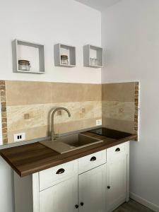 a kitchen with a sink and a counter top at B residence - Apartment A in Iaşi