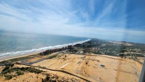 an aerial view of a beach and the ocean at Apec Mandala Mũi Né in Ấp Long Sơn