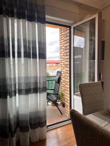 a sliding glass door with a view of a balcony at Medina del descanso in Medina de Pomar