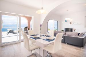 a living room with a table and chairs and a couch at Apartment with a private pool, enchanting view, beach - by Traveler tourist agency ID 2122 in Vrbnik