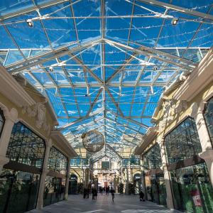 a large glass ceiling in a shopping mall at A due passi da Brignole in Genoa