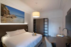 Postel nebo postele na pokoji v ubytování Hotel Delle Palme