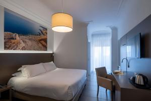 Postel nebo postele na pokoji v ubytování Hotel Delle Palme