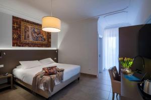 Postel nebo postele na pokoji v ubytování Hotel Delle Palme