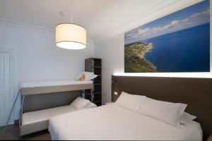 Postel nebo postele na pokoji v ubytování Hotel Delle Palme