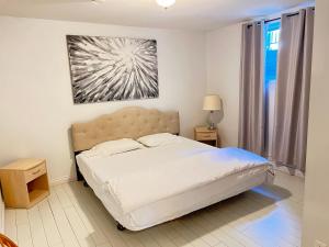a bedroom with a bed and a painting on the wall at Bear Creek Suite in Surrey
