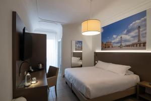Postel nebo postele na pokoji v ubytování Hotel Delle Palme