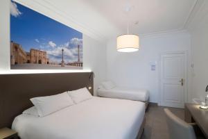 Postel nebo postele na pokoji v ubytování Hotel Delle Palme