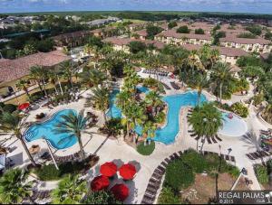 an aerial view of a resort with two pools at Villas at Regal Palms-4 Bedroom3.5 bath Townhouse in Davenport